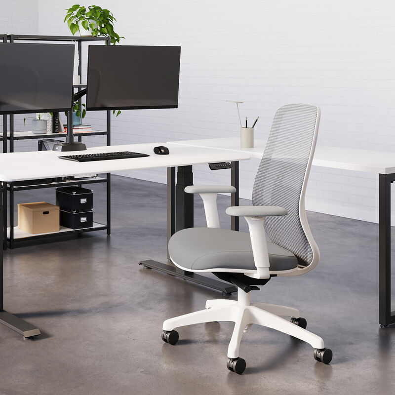 vari ascent chair in fog grey in office setting with professional sitting image number null